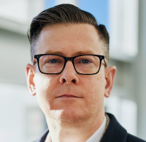 暗号資産取引会社のエグゼクティブであるCEO Alexander Hughesのポートレート